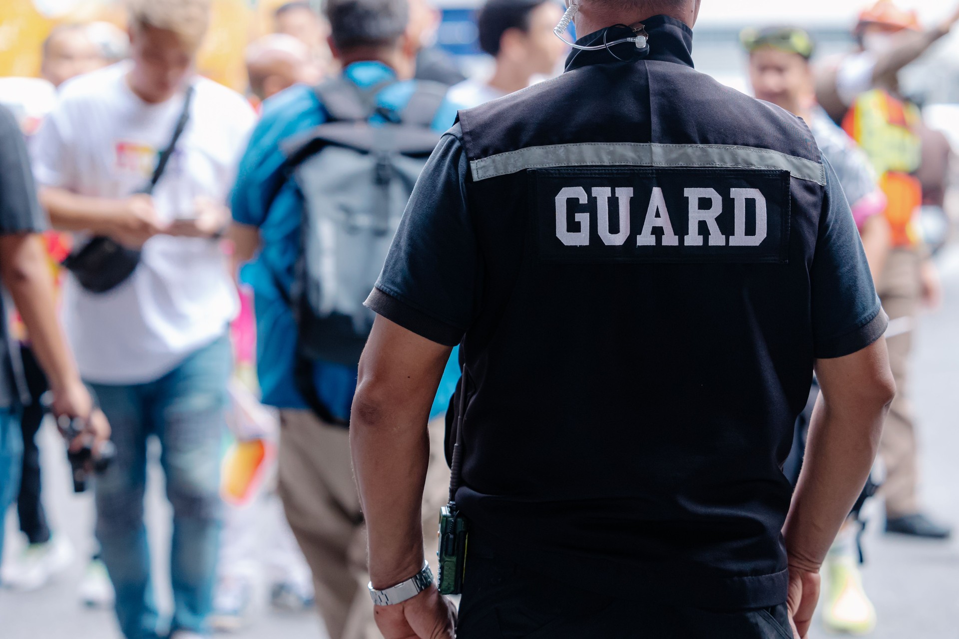 closeup security guard man in public area standing secure people or place outdoor.